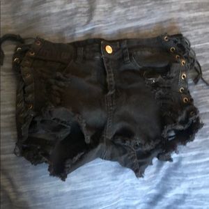 Distressed side lace up shorts